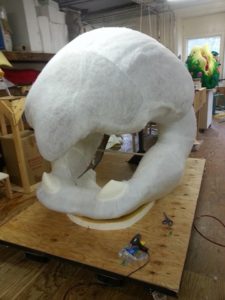 A large white sculpture sitting on top of a table.