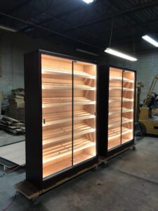 Two large cabinets with lights on top of them.