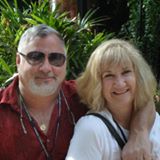 A man and woman posing for the camera.