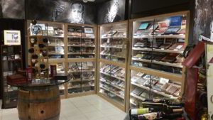 A room filled with lots of shelves full of cigars.