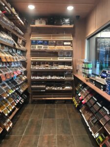 A store filled with lots of shelves full of different types of tobacco.