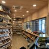 A room filled with lots of shelves and many different types of cigars.