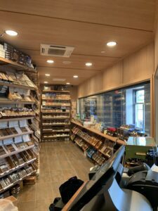 A room filled with lots of shelves and many different types of cigars.