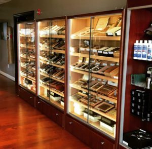 A room filled with lots of shelves full of cigars.