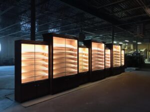 A row of shelves with lights on them.