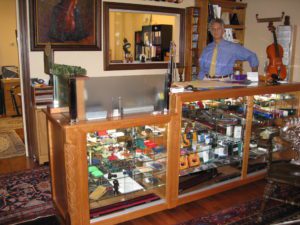 A man standing in front of a display case.