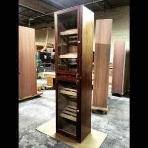 A tall wooden cabinet with glass doors and shelves.