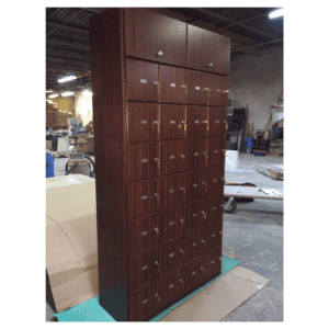 A large wooden cabinet with many drawers and doors.