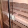 A glass door with a dollar bill on it.