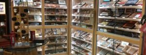 A large display case filled with lots of different types of cigars.
