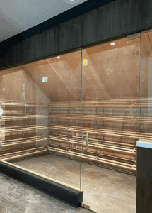 A store window with glass doors and shelves.