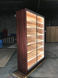 A large wooden cabinet with lights on the inside.