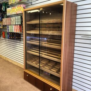 A large display case with glass doors and drawers.