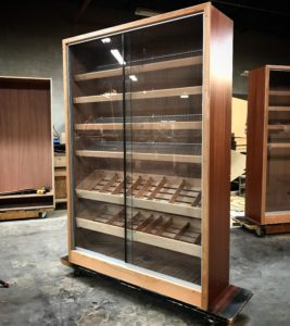 A large display case with many different types of cigars.