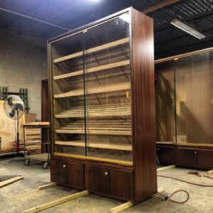 A large wooden bookcase in the middle of being built.