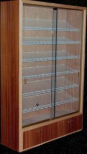 A wooden display case with glass doors and shelves.