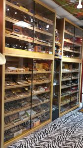 A large display case filled with lots of cigars.