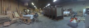 A warehouse filled with lots of furniture and boxes.