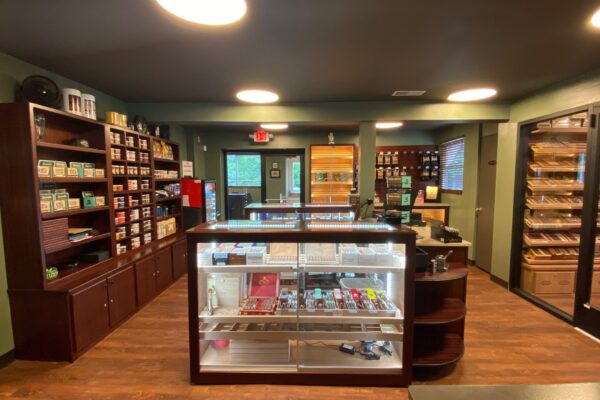 Leaf to Ash cigar lounge retail area with custom POS display and walk-in humidor Leaf to Ash cigar lounge retail area with custom POS display and walk-in humidor by Newsham’s Woodshop