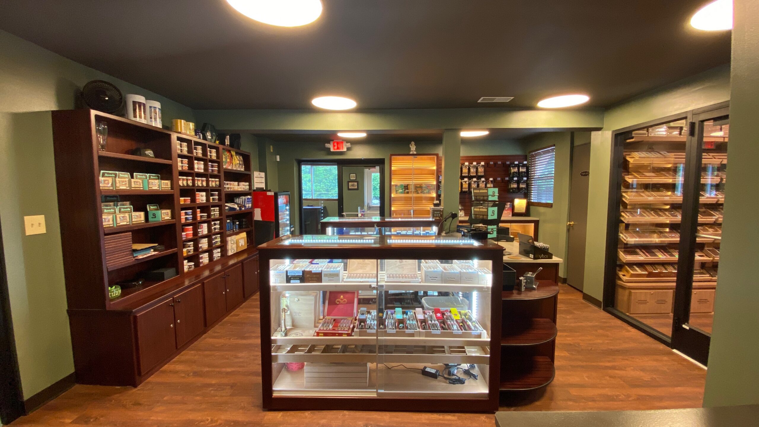 Leaf to Ash cigar lounge retail area with custom POS display and walk-in humidor by Newsham’s Woodshop
