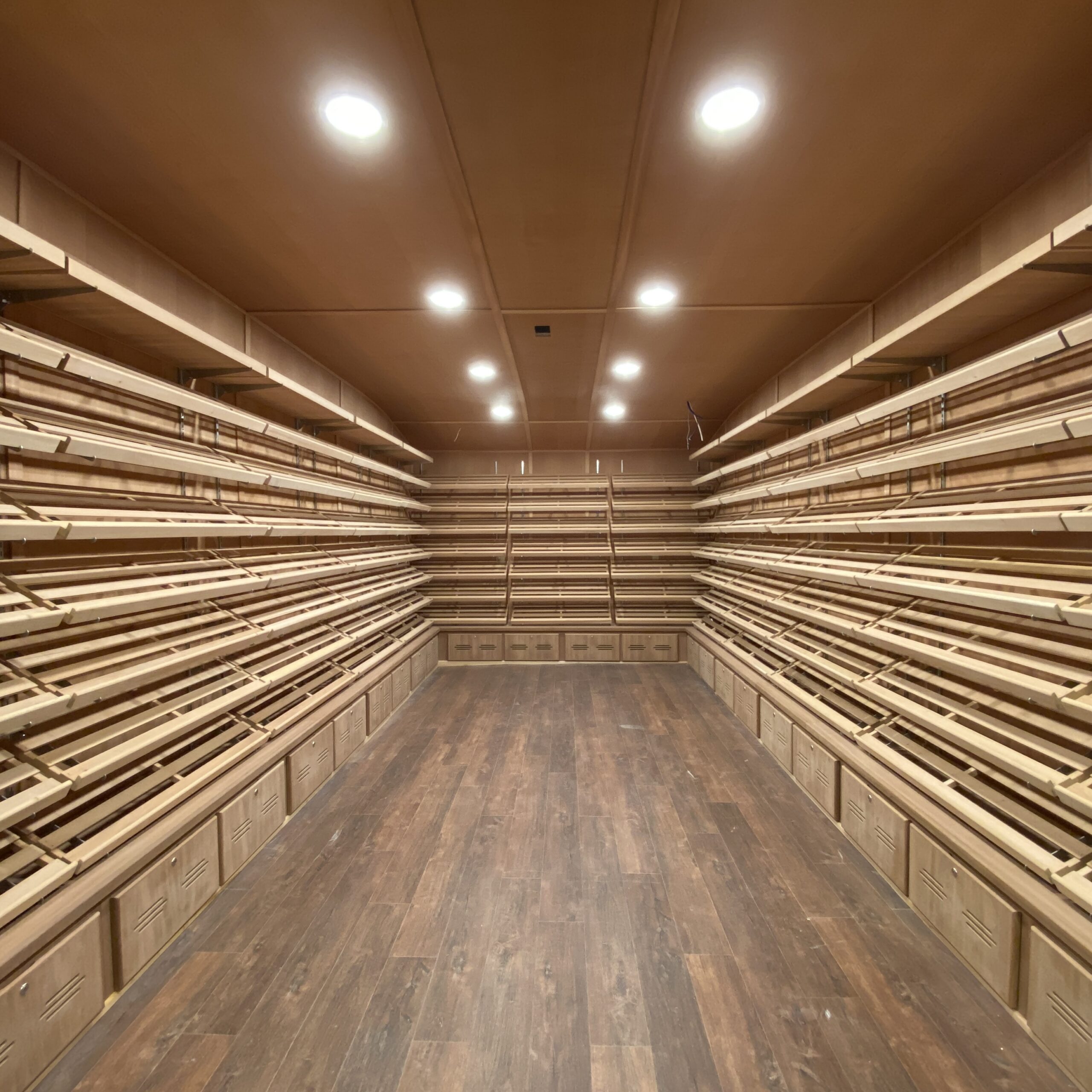 Bottom storage and display areas inside a custom walk-in cigar humidor