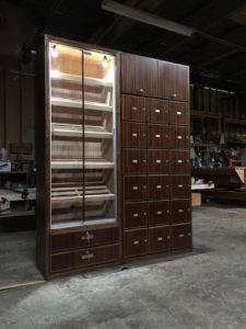 A large cabinet with many drawers and shelves.