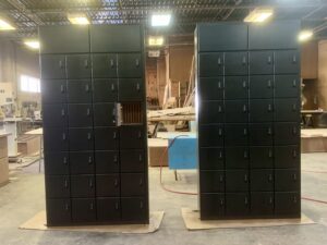 A couple of black cabinets in a room.