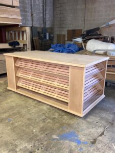 A large wooden shelf with many shelves in it