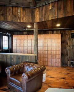 A room with wood paneling and a leather chair.
