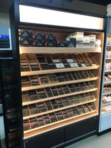 A display case filled with lots of cigars.