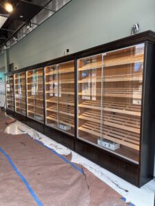 A large display case in an empty room.