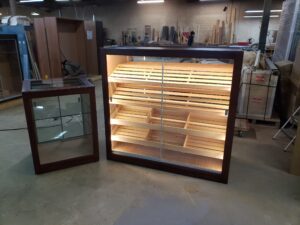 A display case and table in a room.