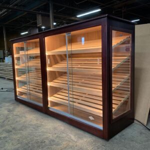 A large display case with lights on top of it.