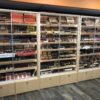 A room filled with lots of shelves full of different types of cigars.
