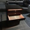 A drawer with a lit up compartment in it.