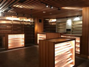 A room filled with wooden shelves and lights.