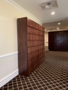 A room with many wooden lockers in it