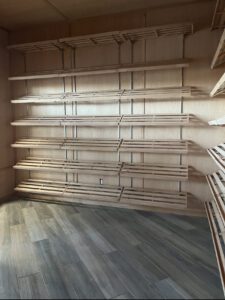 A room with many shelves and floors in it