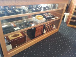 A display case with many different types of cigars.