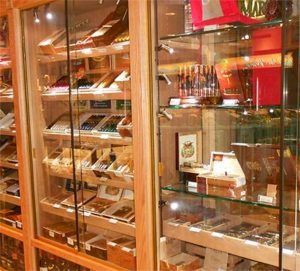 A display case filled with lots of different types of cigars.